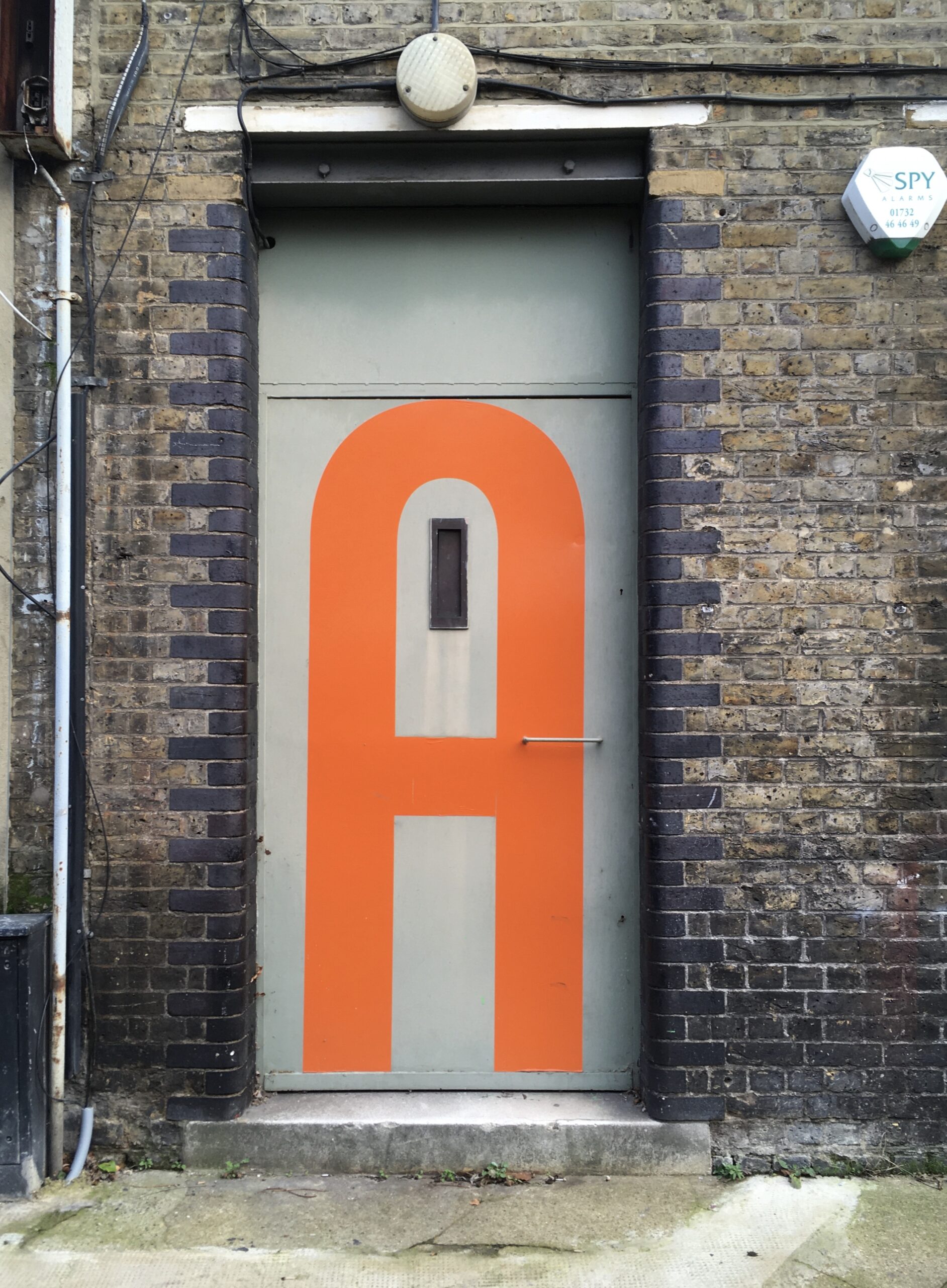 Door with an A on it near London Bridge.